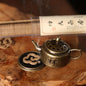 RootedRelief.co.za's tiny bronze Zen mini teapot‑shaped incense burner (6cm x 3.3cm) comes with 1 tube of incense coils
