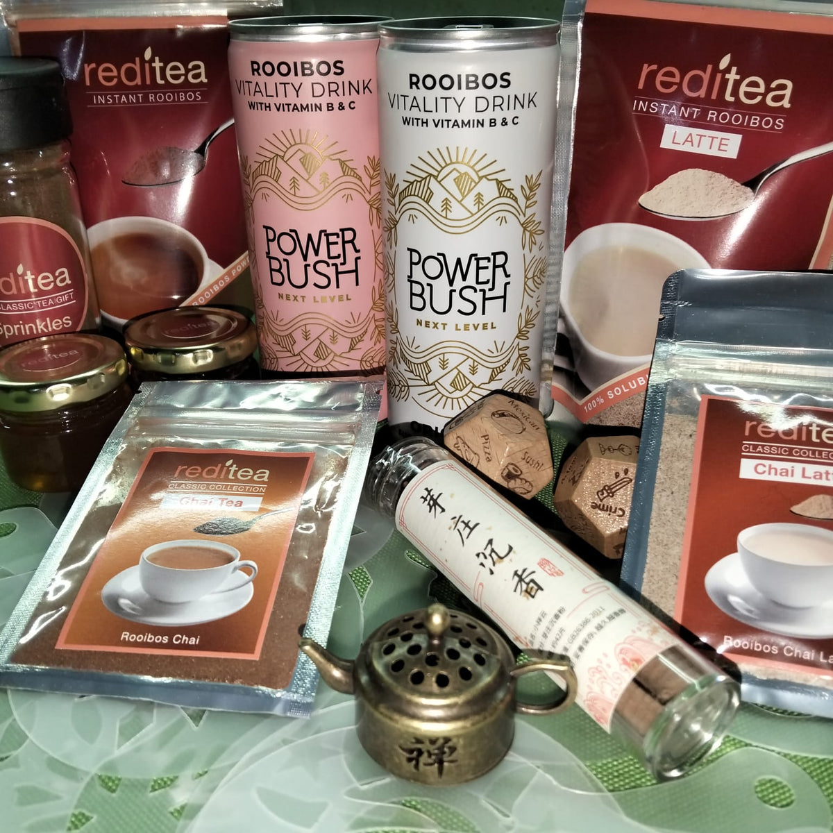 What's inside:

reditea Rooibos (65g)
Latte (120g)
Chai reditea Classic Collection pouch (makes 4 cups)
Chai Latte reditea Classic Collection pouch (makes 2 cups)
Honey x 2 (30ml each)
Zen Teapot with Incense
Sprinkles (80g)
Stencils (full set of 10)
Decided Dice (movie and food) - simply roll the dice, don't guess. The dice will decide for you on the food for the evening and the type of movie to watch.&nbsp; Switch off, relax, you are safe now.&nbsp;
1 × Power Bush Original (250ml)
1 × Power Bush Grapefrui
